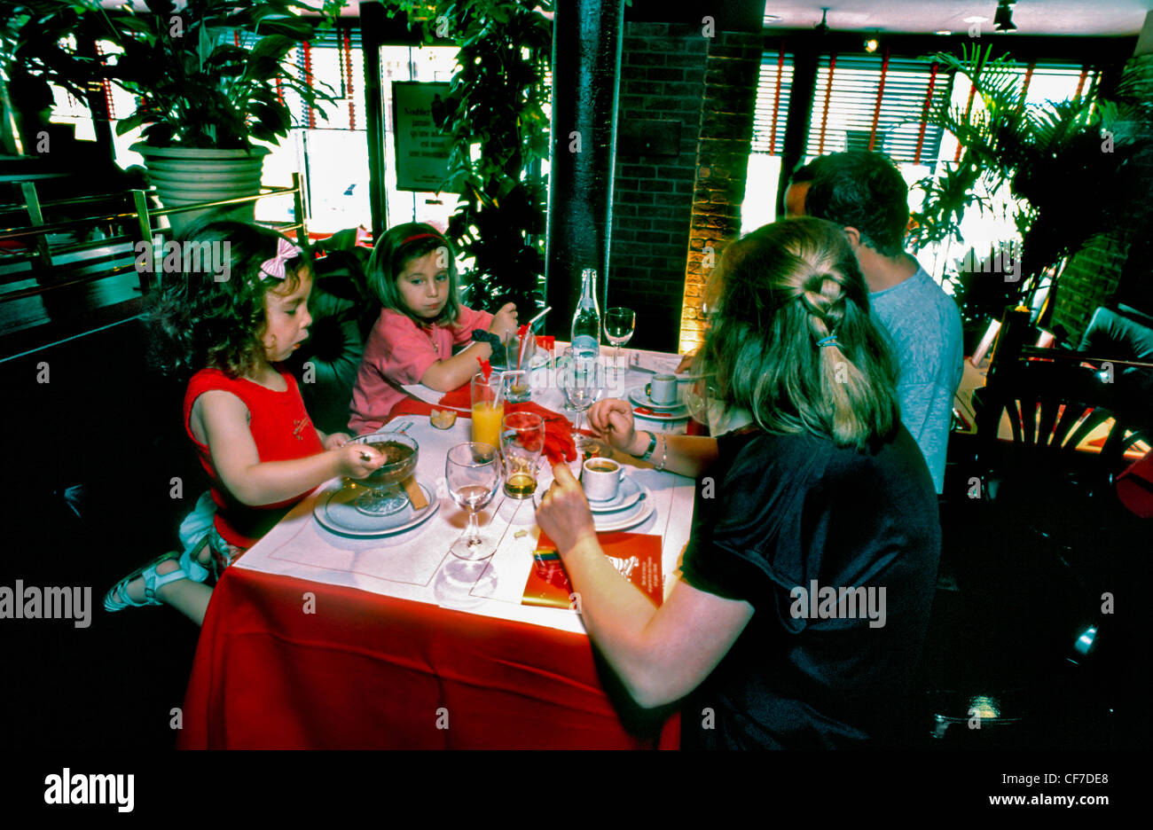 French Family With Two Girls Dining in a Brasserie Restaurant, 'Hippopotamus', Paris, France. (M.R.) middle class family at the restaurant Stock Photo
