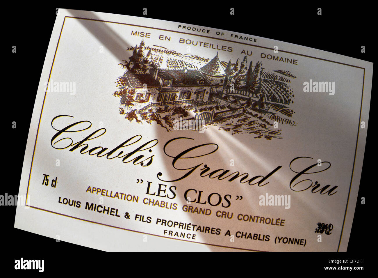 Chablis Grand Cru ''Les Clos'' Louis Michel wine bottle label  Wine Tasting Glass shadow.  Chablis Yonne France Stock Photo