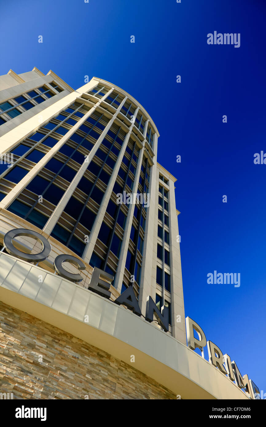 Modern building in uptown Dallas shot upwards against a deep blue sky. Stock Photo