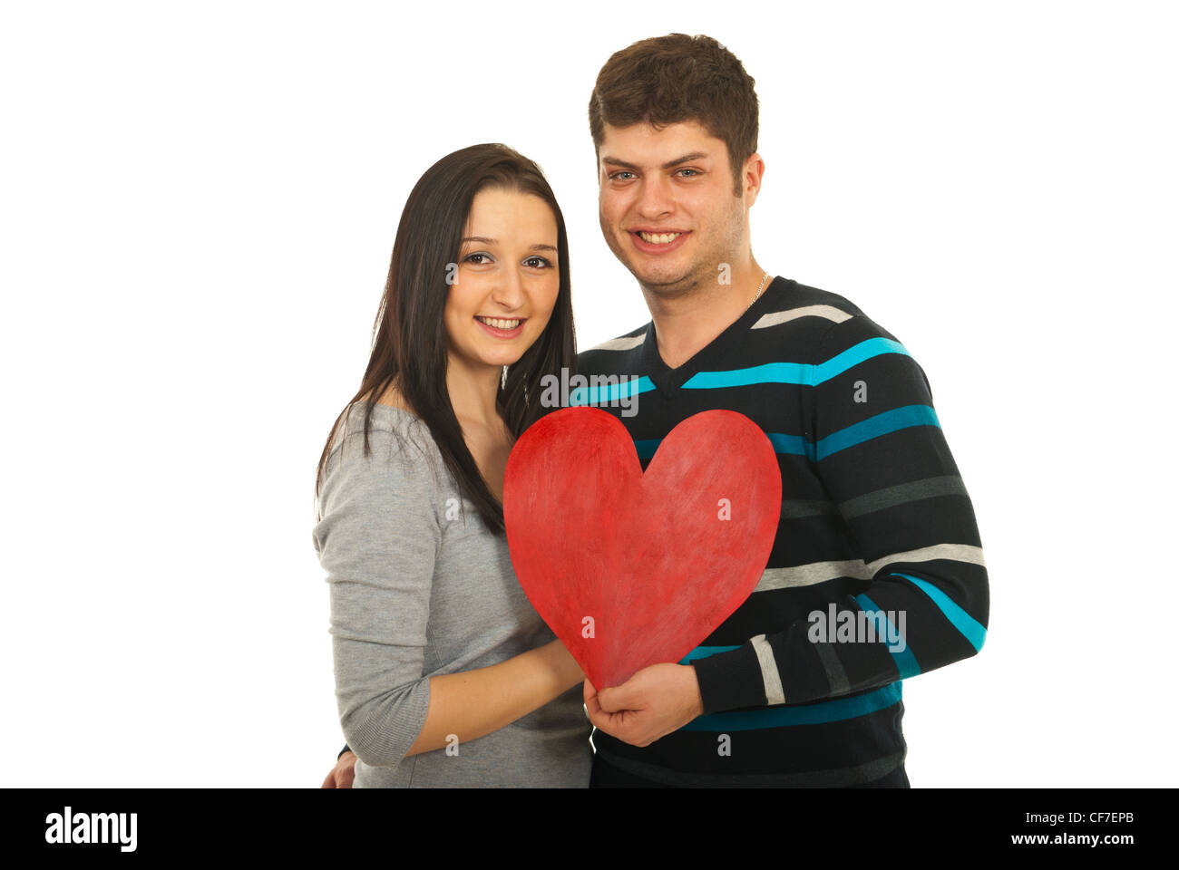 Attractive young couple holding heart shape isolated on white ...