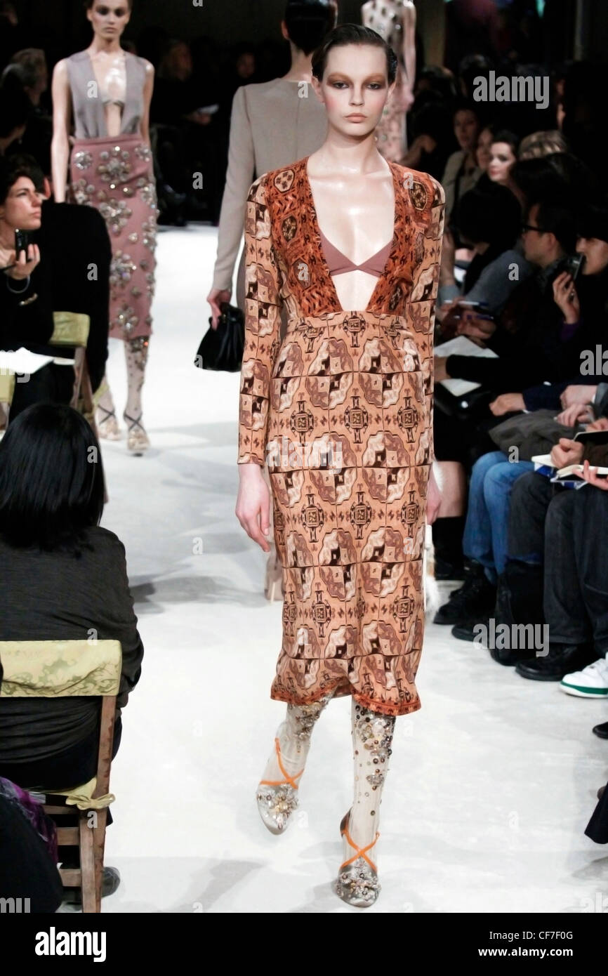Miu Miu Paris Ready to Wear Autumn Winter Low cut brown patterned dress with long sleeves Stock Photo