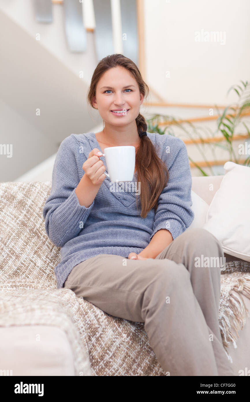 Portrait of a woman holding a cup of coffee Stock Photo - Alamy