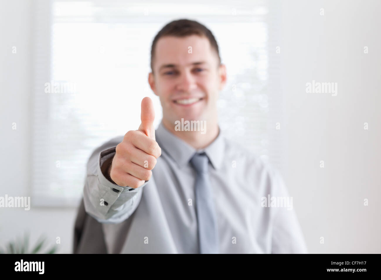 Smiling businessman approves Stock Photo