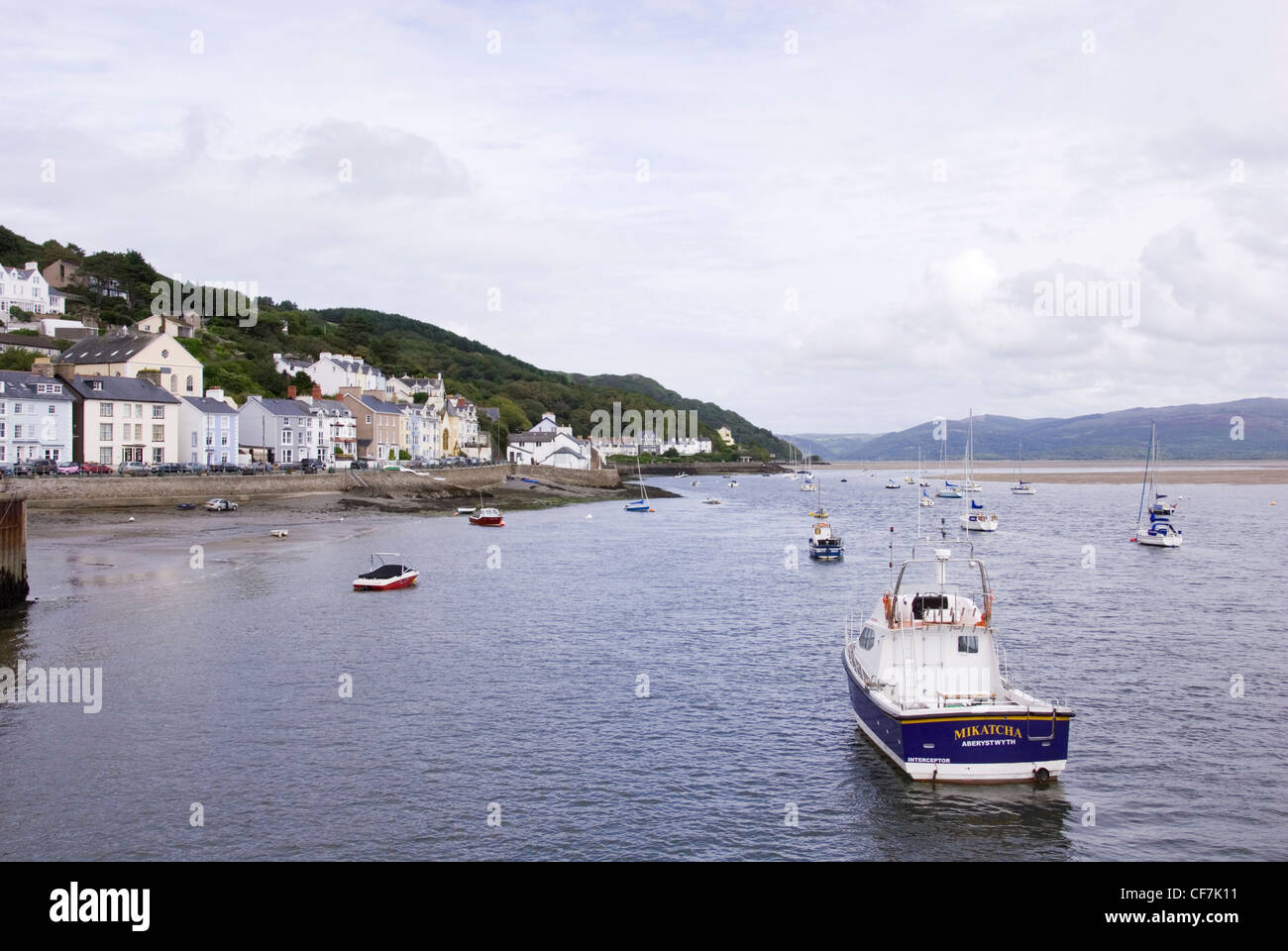 Boats Anchored in Calm Water at Aberdovey where the River Dyfi meets Cardigan Bay, Aberdyfi, North Wales, UK Stock Photo