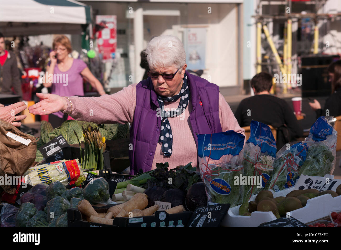 Stallholder At A Farmers Market Fruit and Vegetables Stall Stock Photo