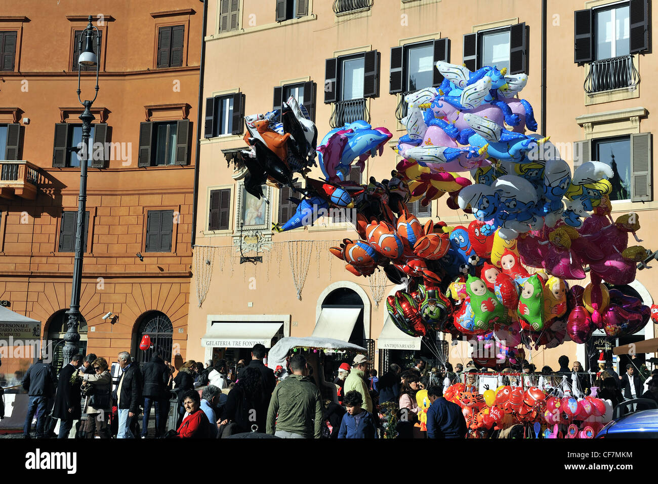 Crowds at Christmas market and balloon seller in the Piazza Navona