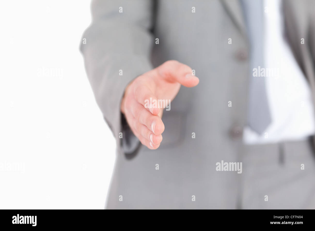 Businessman giving a helping hand Stock Photo - Alamy