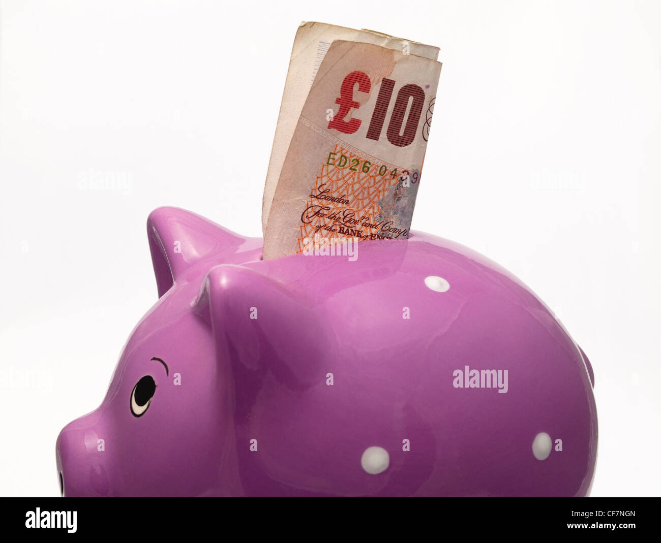 Piggy Bank money box with a British ten pound note Stock Photo