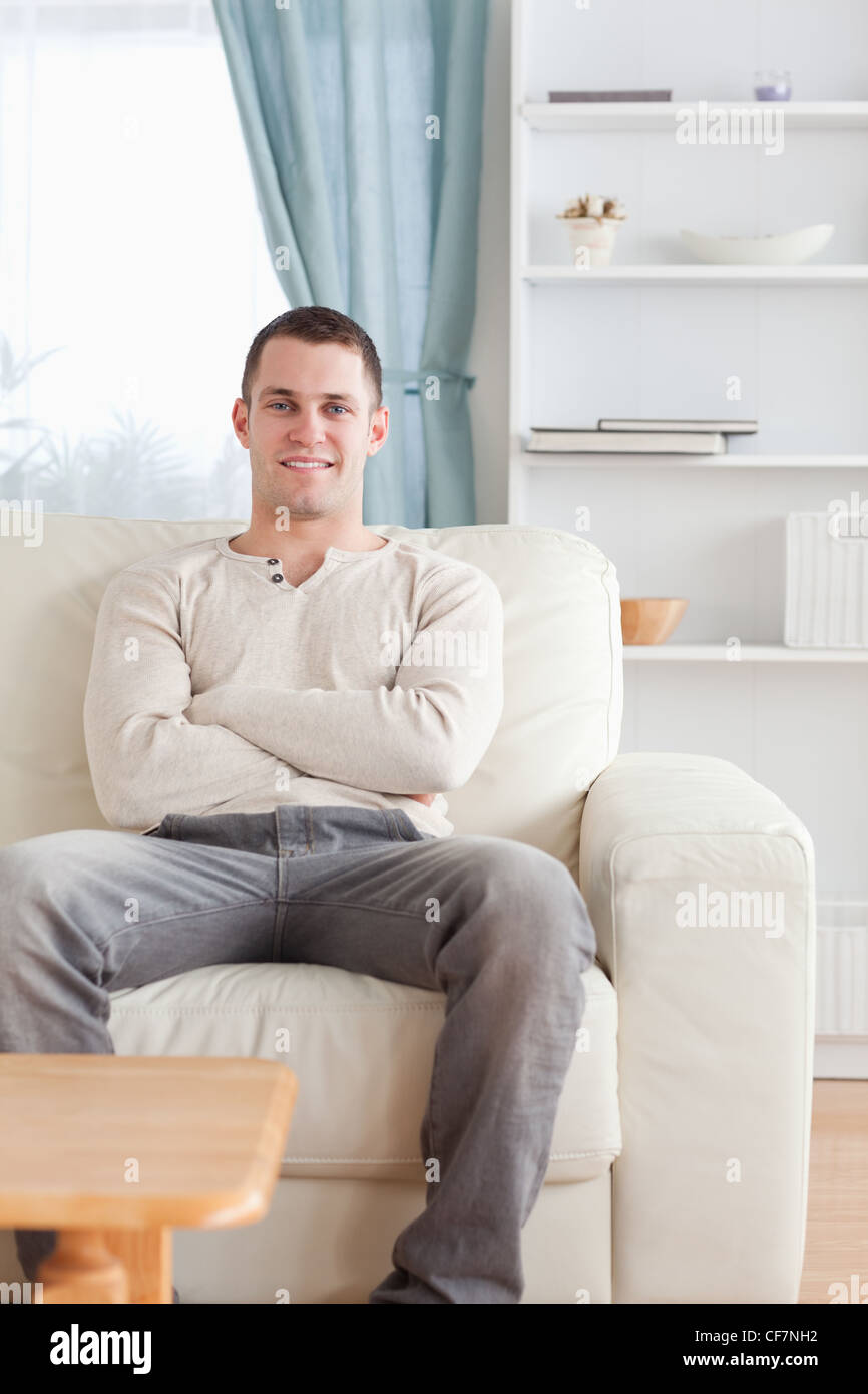 Portrait of a man sitting on a couch Stock Photo Alamy