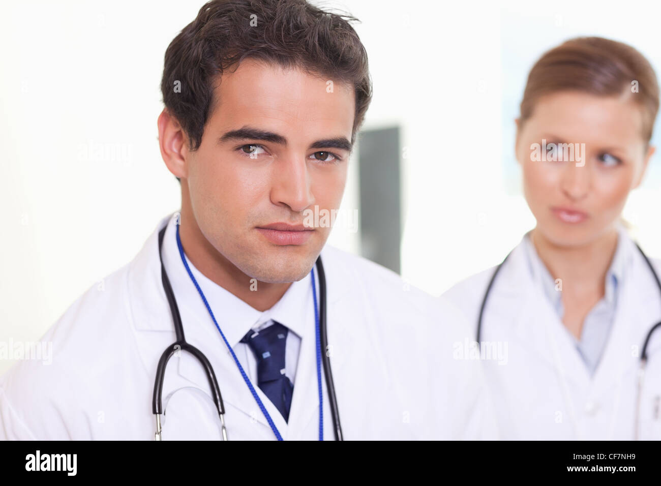Assistant doctors standing next to each other Stock Photo - Alamy