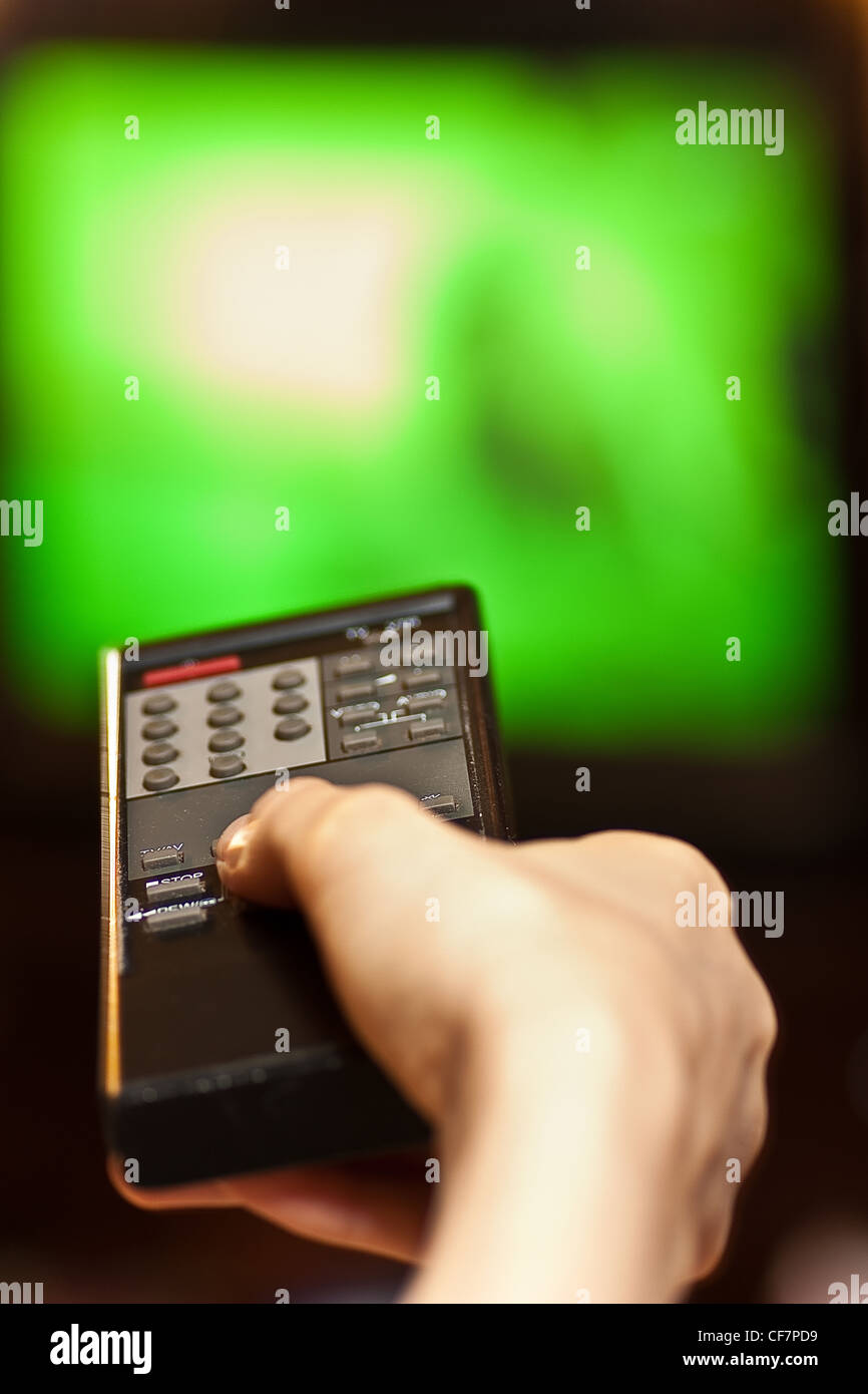 Hand Using Remote Control Hand with remote control Stock Photo - Alamy