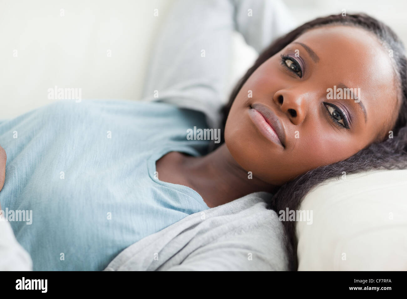 Close up of woman taking a rest on the sofa Stock Photo
