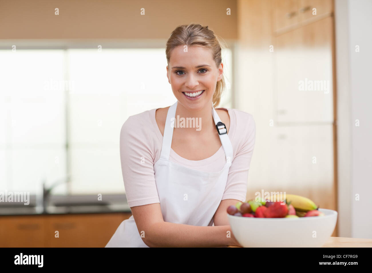 Woman posing with a fruit basket Stock Photo - Alamy