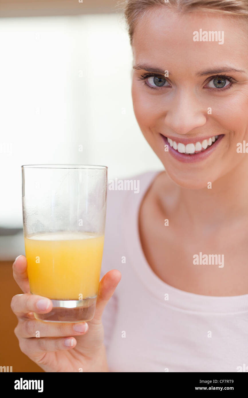 Portrait of a young woman drinking orange juice Stock Photo Alamy