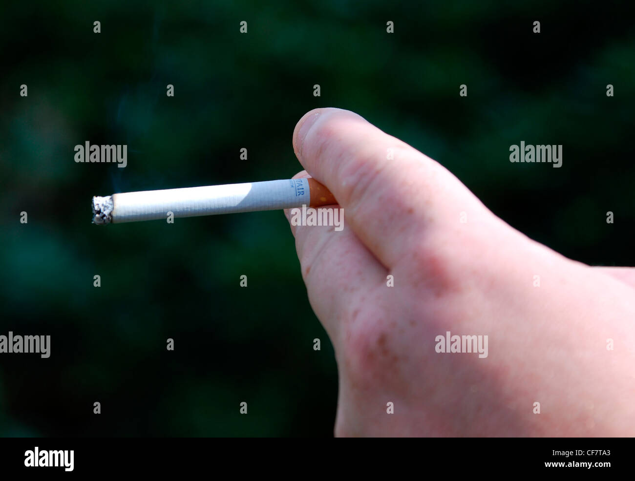 Man smoking a cigarette model release Stock Photo