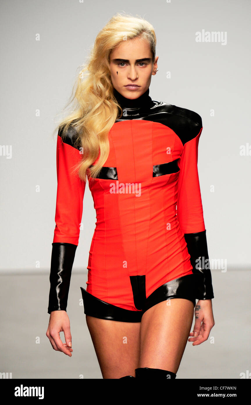Pam Hogg London Ready to Wear Autumn Winter Model Alice Dellal, wearing a black and red playsuit Stock Photo