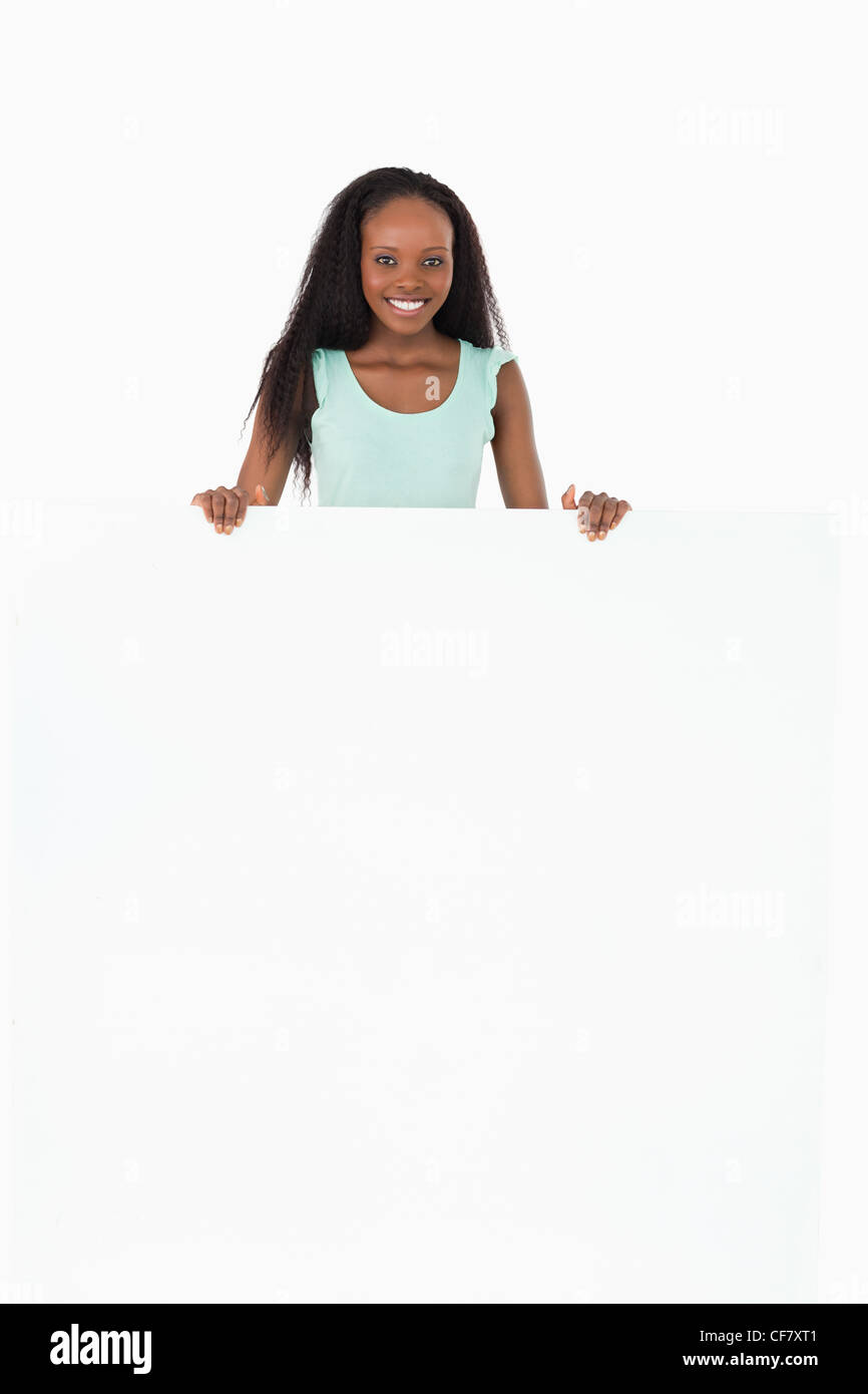 Woman holding wild card on white background Stock Photo