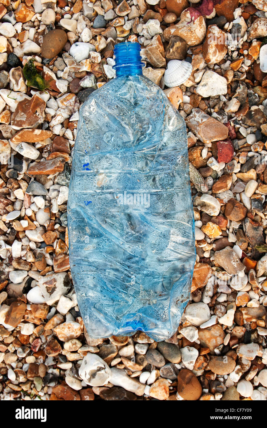 plastic bottle washed up on the beach Stock Photo