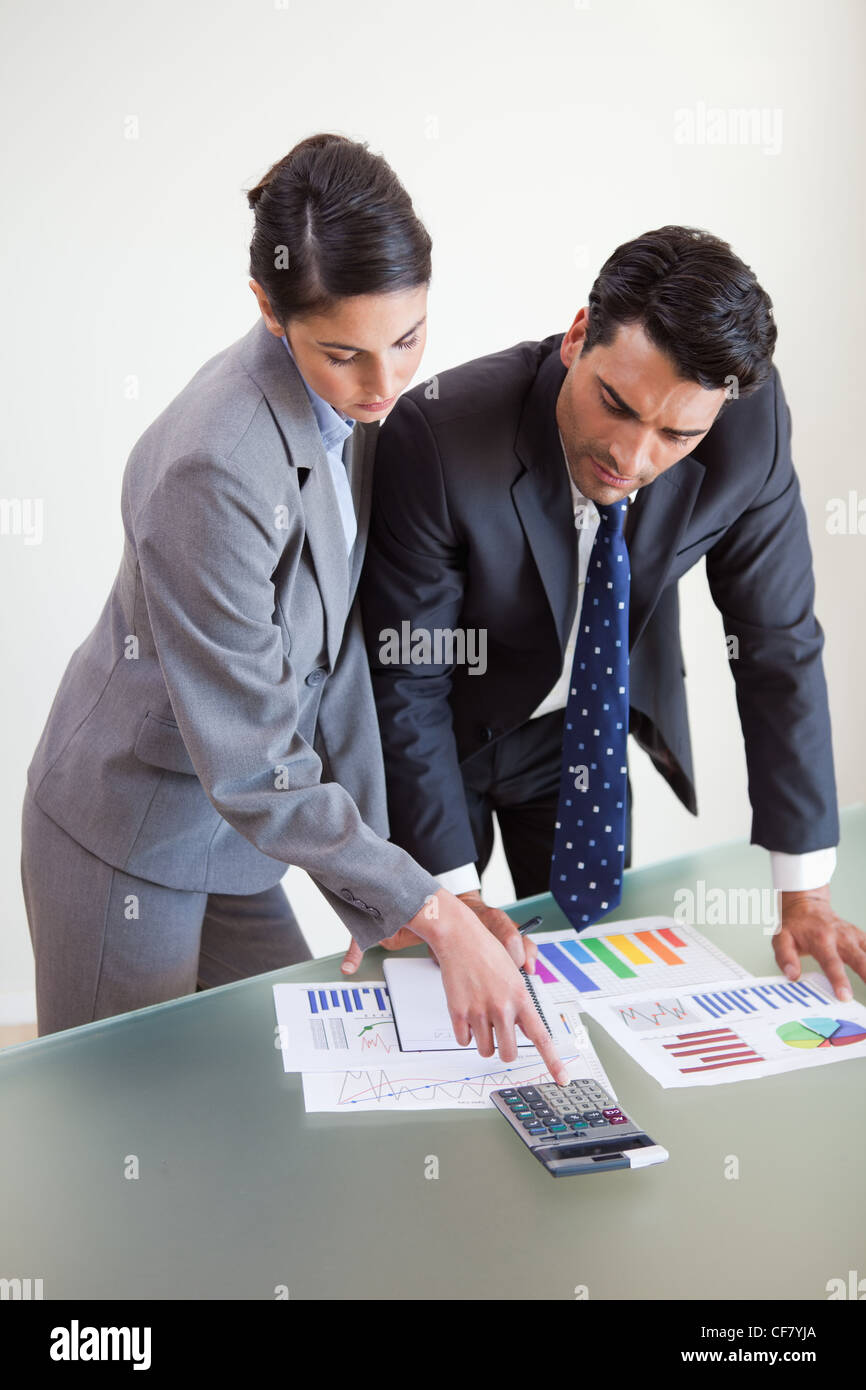 Portrait of focused sales persons studying their results Stock Photo