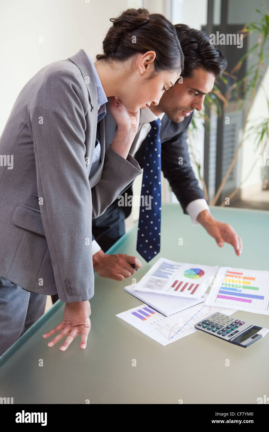 Portrait of young sales persons studying their results Stock Photo
