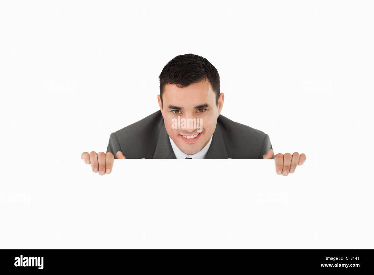 Businessman looking over wall Stock Photo Alamy