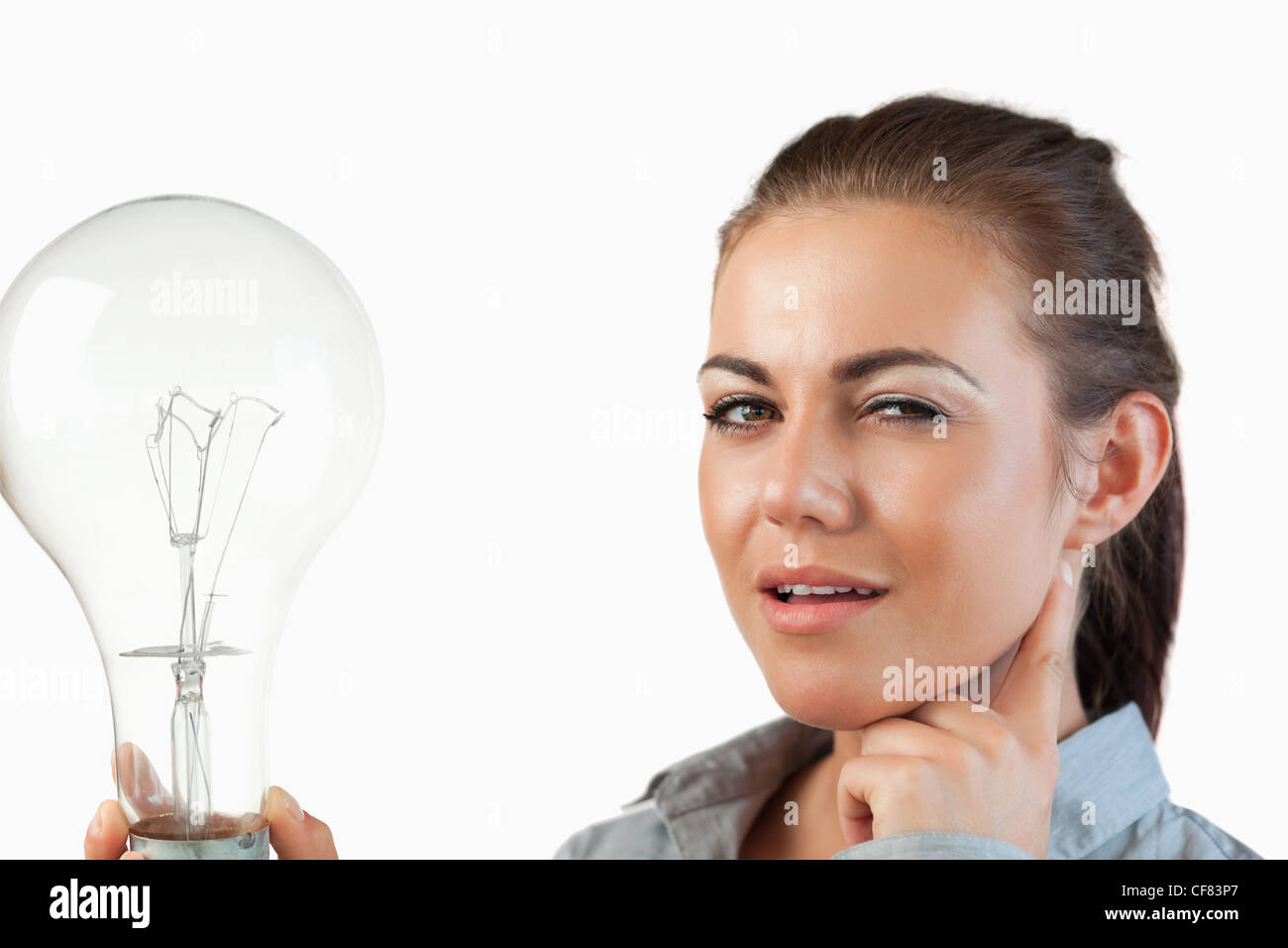 Businesswoman with huge light bulb Stock Photo