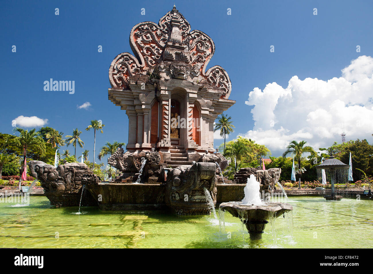 Indonesia, Asia, Bali Island, Nusa Dua, Resorts, Entrance, square, fountain, Balinese, architecture, garden, clouds Stock Photo