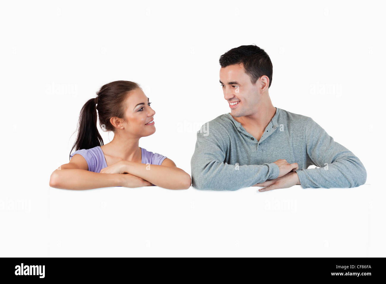 Young couple leaning on each other Cut Out Stock Images & Pictures - Alamy