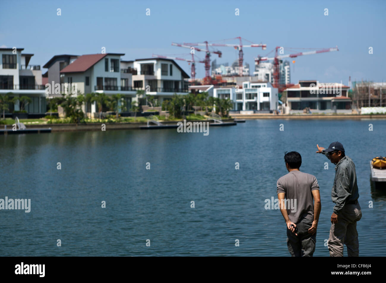 Waterfront luxury homes and condominium apartments are seen at Sentosa Cove in Singapore. Stock Photo