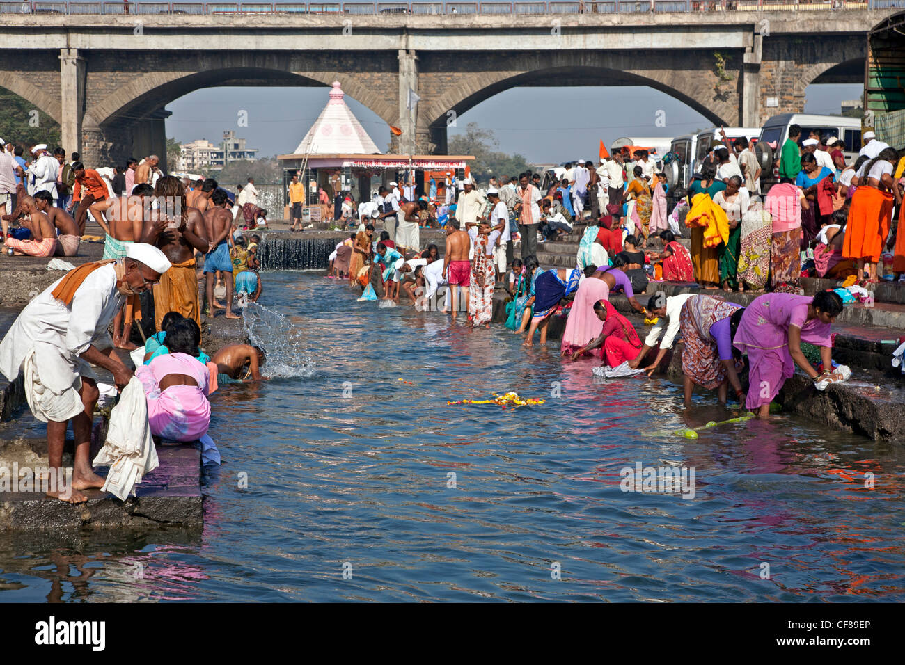 Pilgrims making the ritual ablutions. Ram Kund. Godavari river. Nasik. India Stock Photo