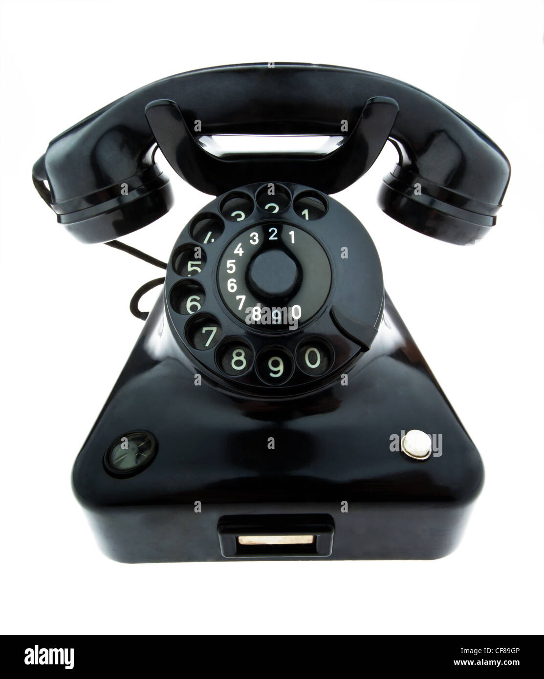 an old, old landline telephone. phone on a white background. Stock Photo
