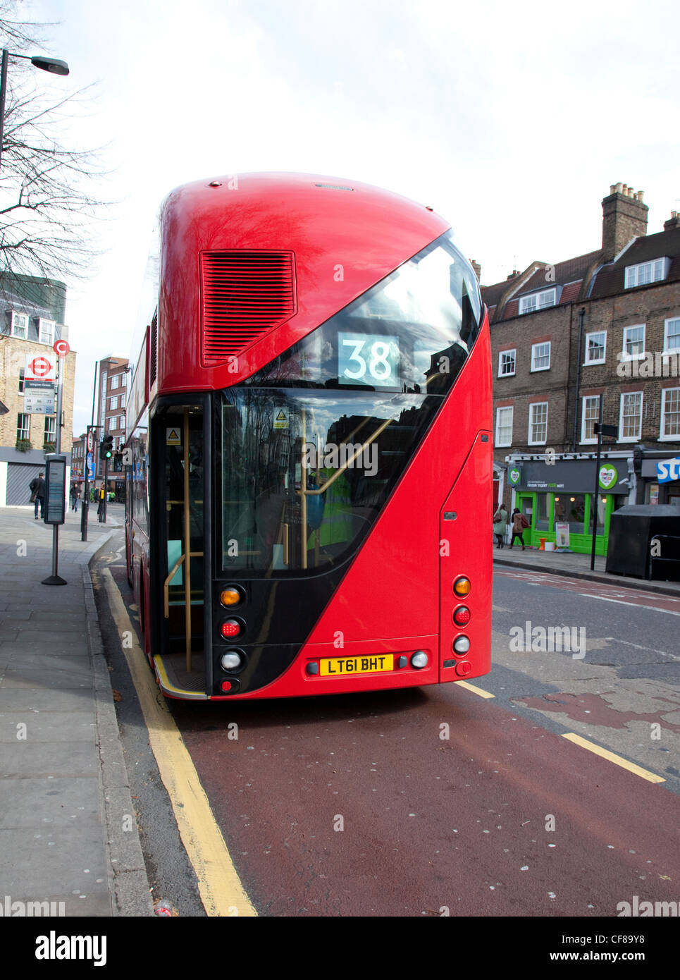 New Routemaster at bus stop, London - open rear platform Stock Photo