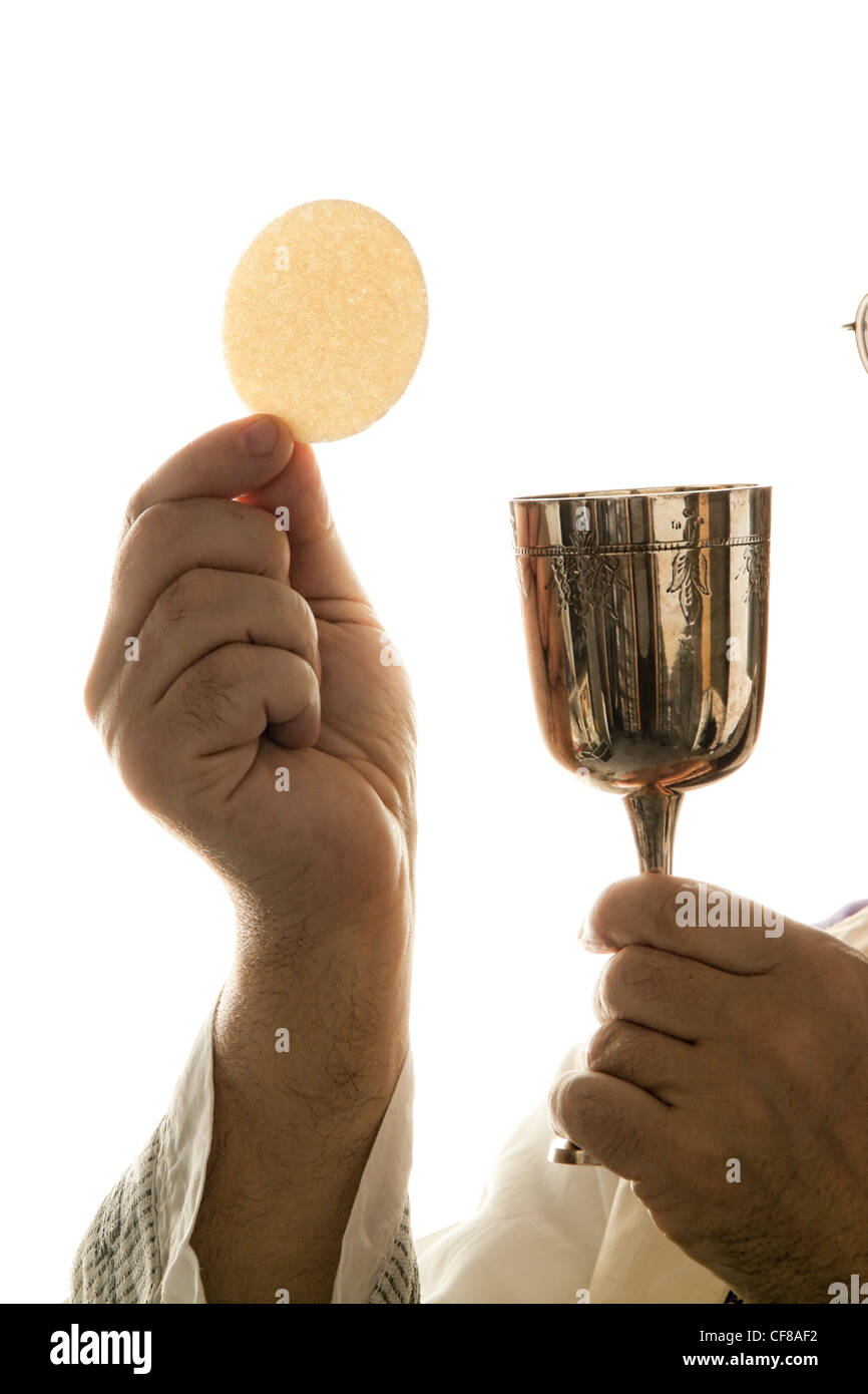 a catholic priest in the communion in worship Stock Photo