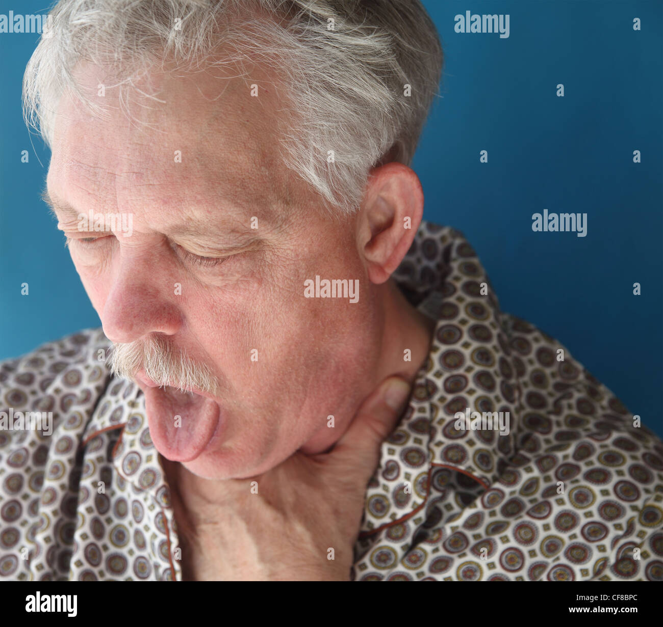 an older man with a bad cough Stock Photo