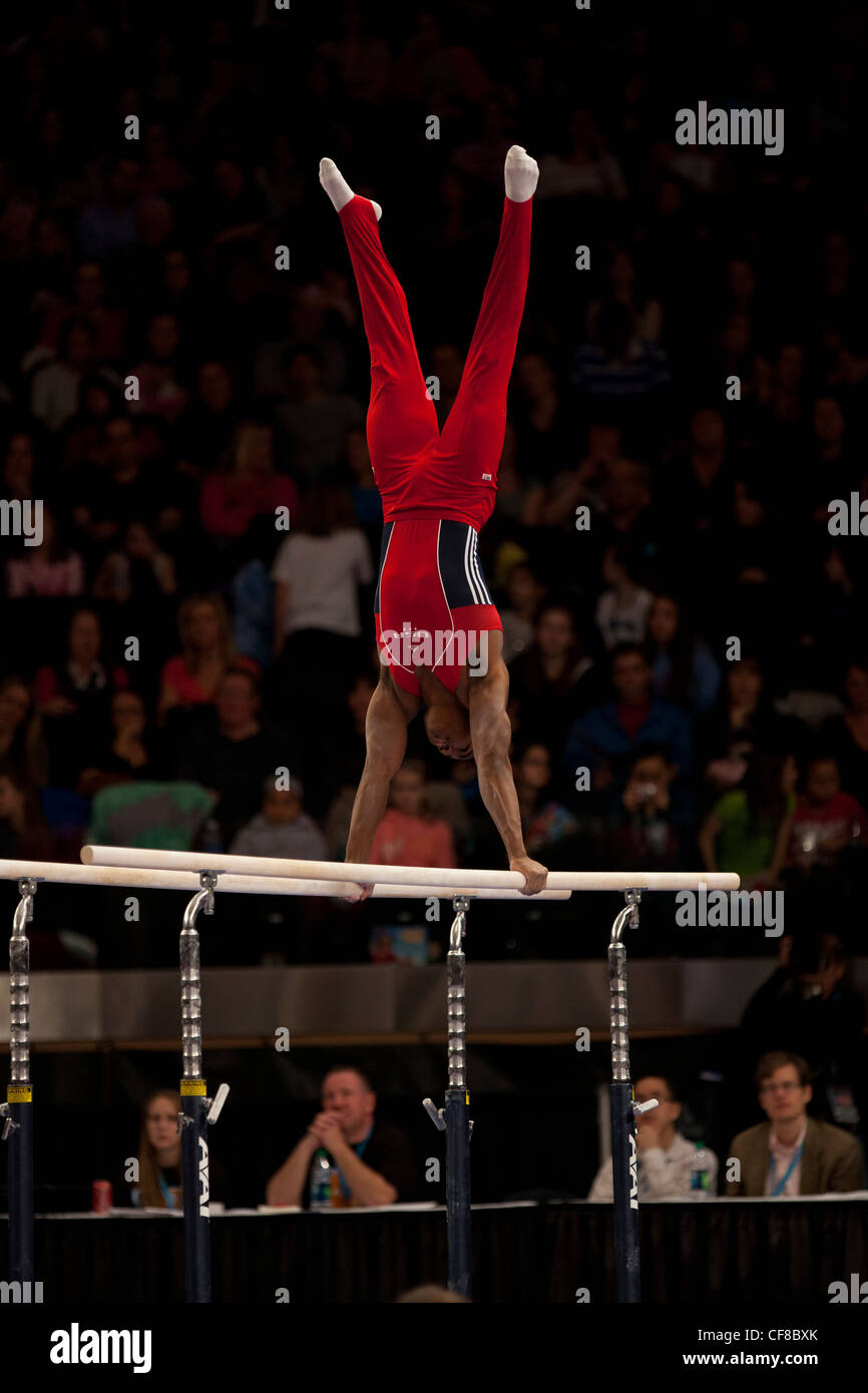 John Orozco (USA) competes in the parallel bars event at the 2012 American Cup Gymnastics Stock Photo