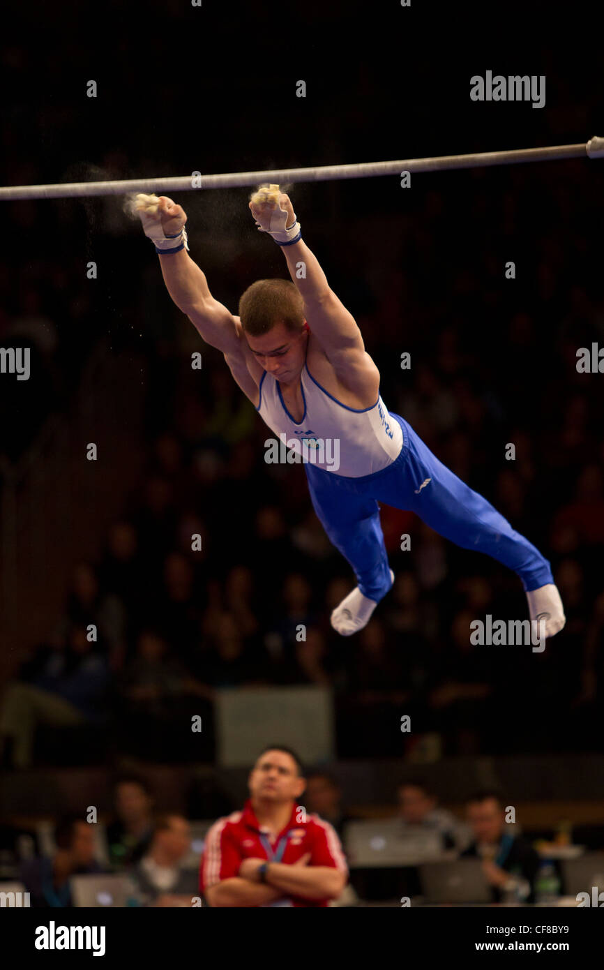 Oleg Verniaiev (UKR) competes in the high bar event at the 2012 American Cup Gymnastics Stock Photo