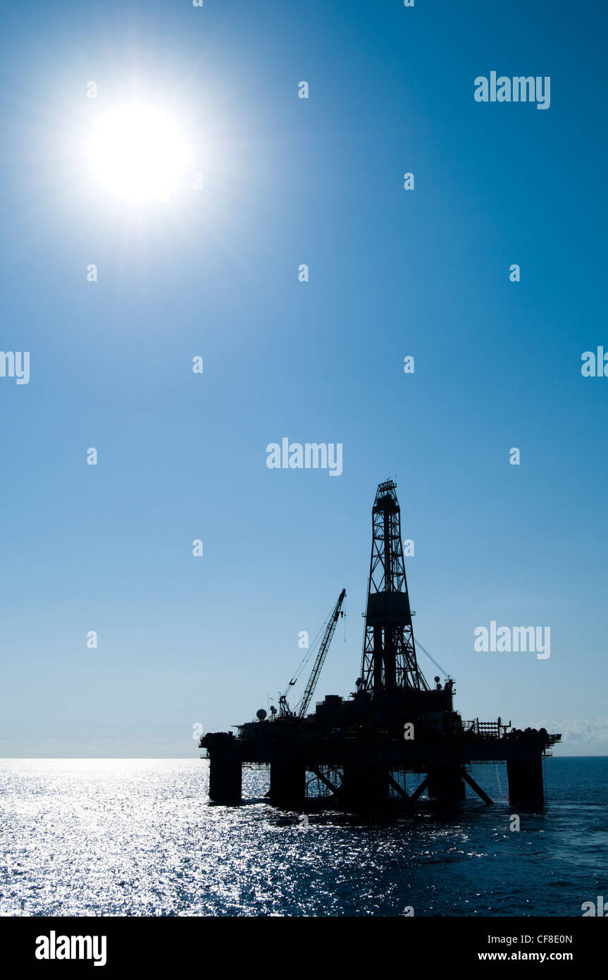 Silhouette of an offshore floating oil drilling rig.  Coast of Rio de Janeiro state, Southeast Brazil. Campos Basin. Stock Photo