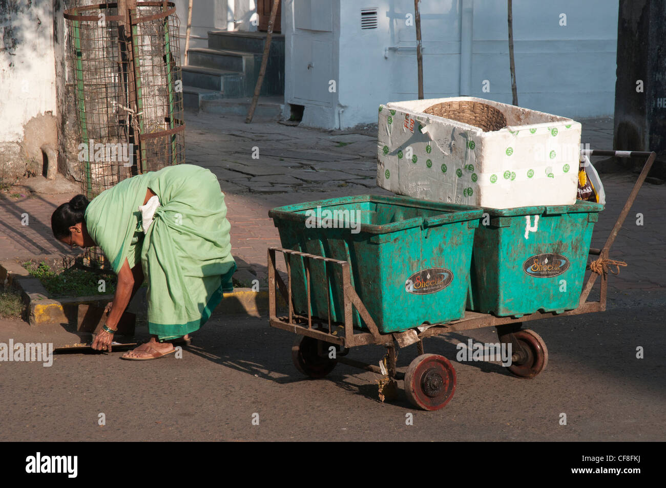 Woman gathering rubbish, Mumbai Stock Photo