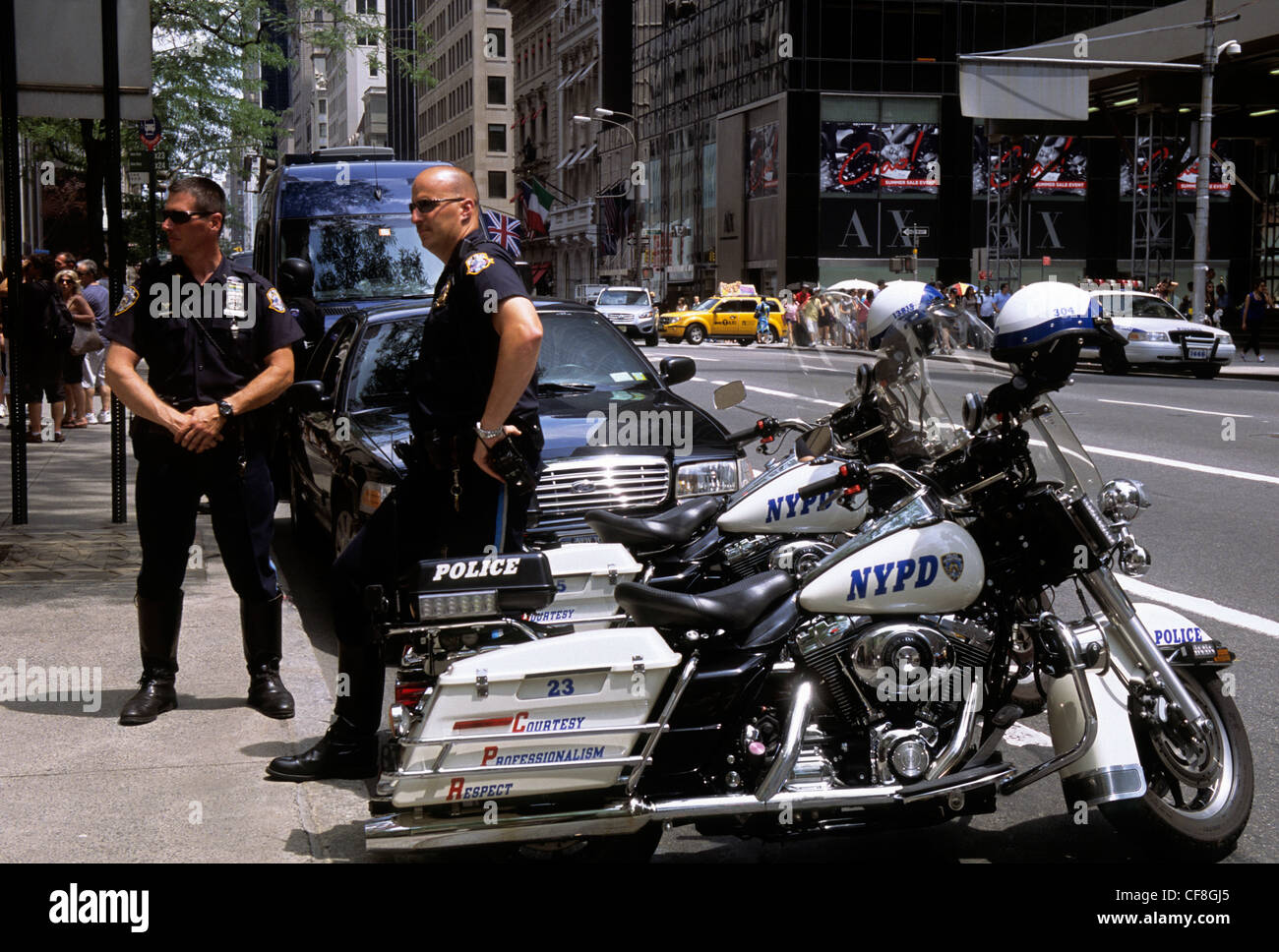 Policemen and motorcycles on the street. New York City police ...