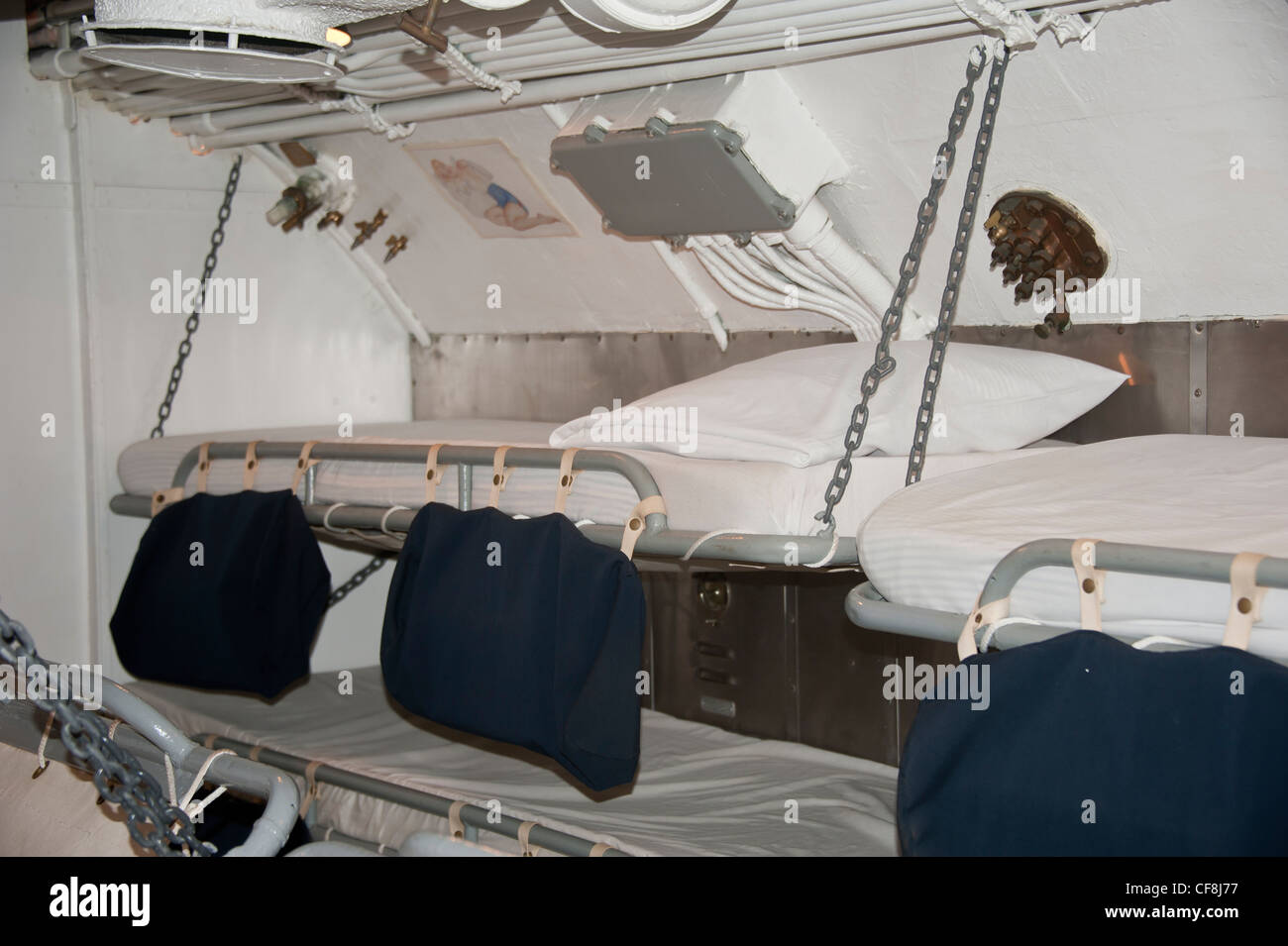 Sleeping bunk on a World War II submarine. The black bags held the