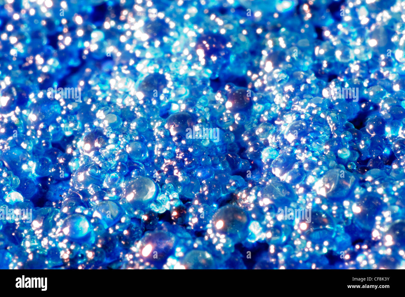 abstract science background with small blue toned translucent beadlets ...