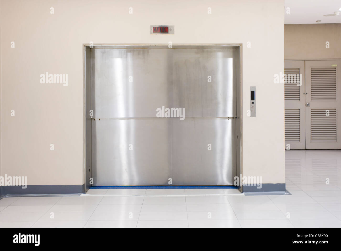 Two Section SlideUp Door of Freight elevators in modern building. Can be office, school
