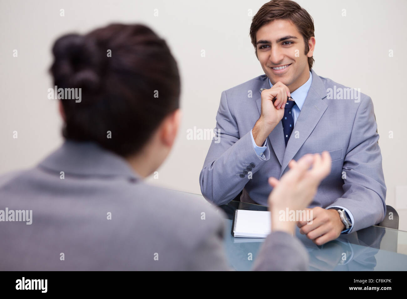 Smiling businessman in a negotiation Stock Photo