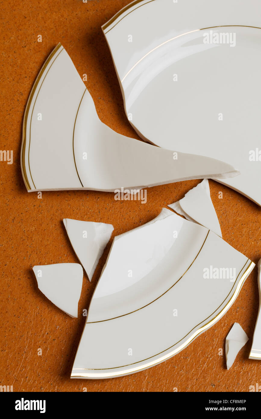 a broken dish is on the floor in the kitchen Stock Photo Alamy