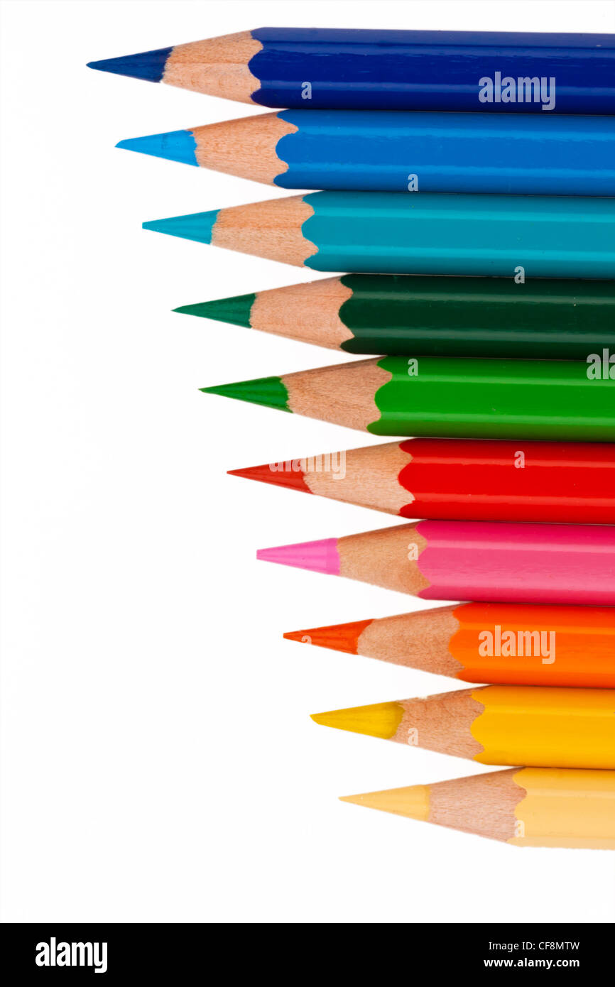many different colored crayons on a white background Stock Photo