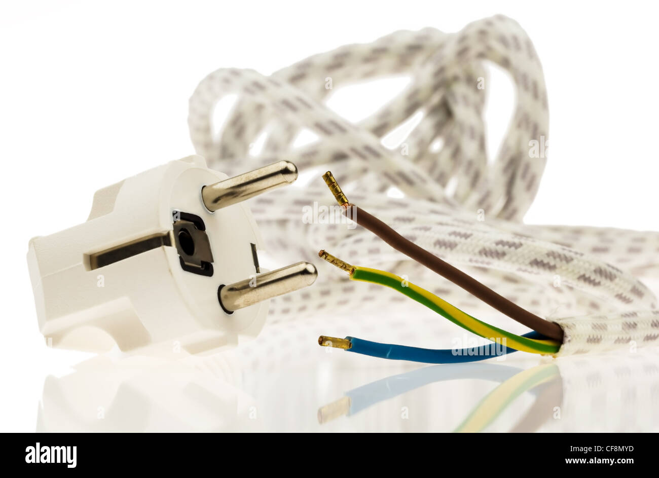 a power cord with power plug for electrical energy. electricity in the home. Stock Photo