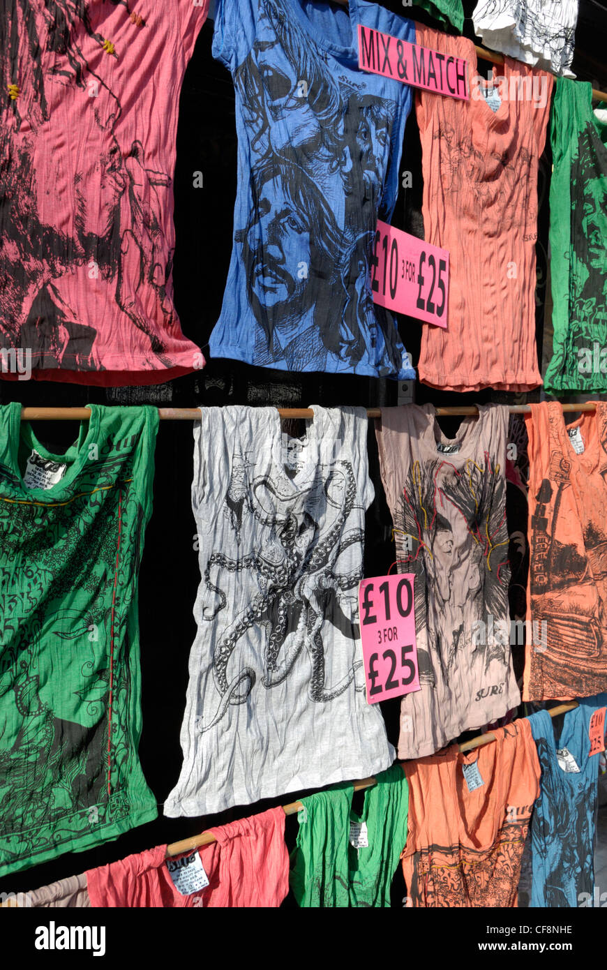 Original, colourful t-shirts displayed outside a fashion shop Stock Photo