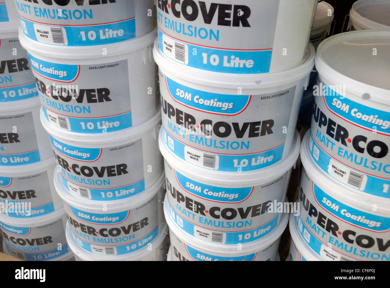Large pots of Super Cover matt emulsion paint in a shop window Stock Photo