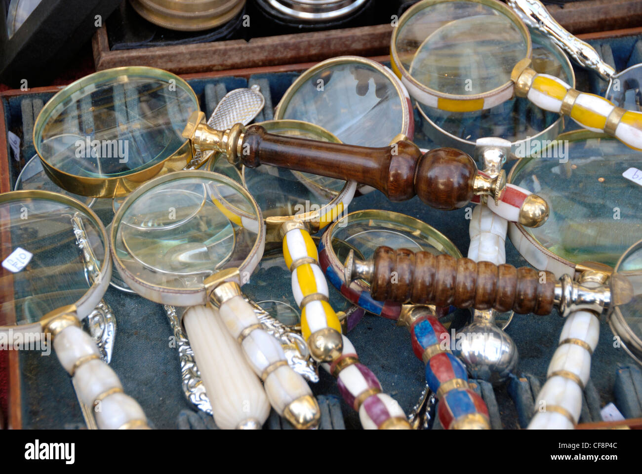 Antique magnifying glasses on a stall Stock Photo