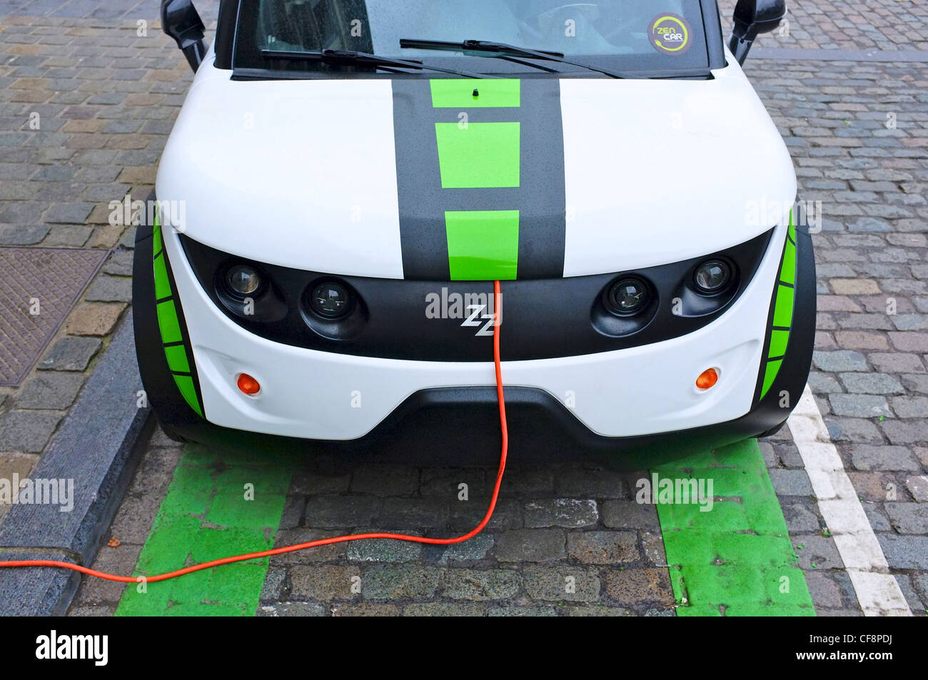 Green energy 'Zen Car' electric car-share vehicle charging up in Brussels city centre Stock Photo